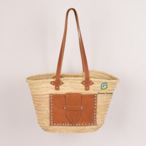 Straw tote bag with studded leather pocket by Green Doum