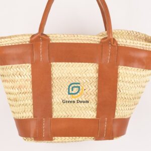 Straw tote with leather bands by Green Doum